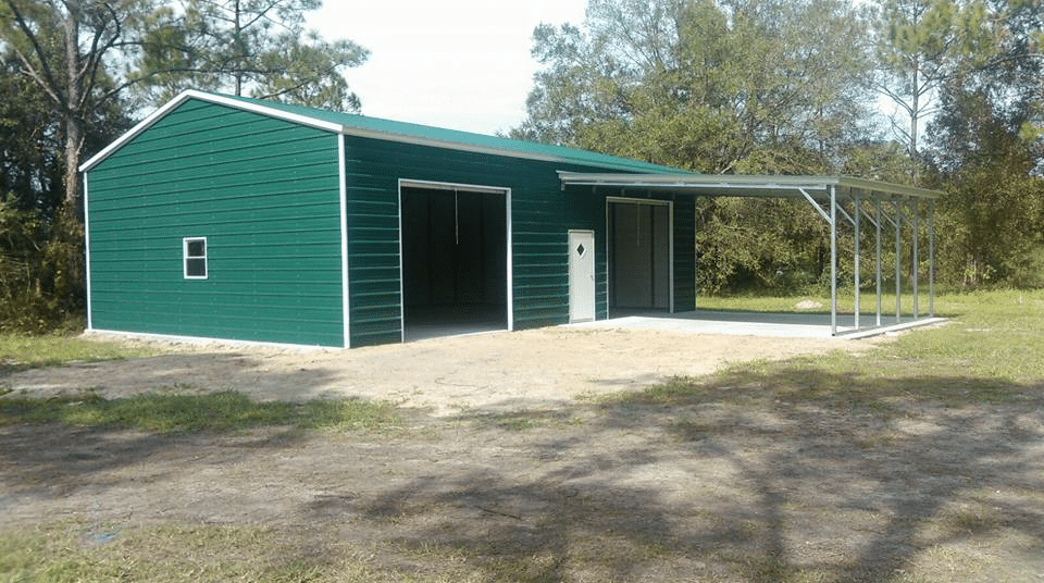 green metal building with 2 rollup doors one walk in door and a vehicle cover from Outdoor Options in Eatonton Georgia